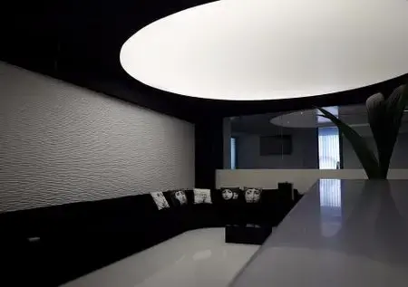 Large circular architectural light installed in a private clinic interior