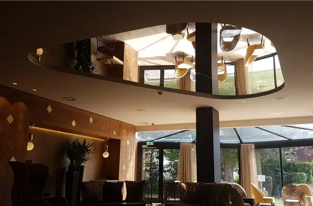 A bold mirror ceiling feature designed for contemporary architectural spaces.